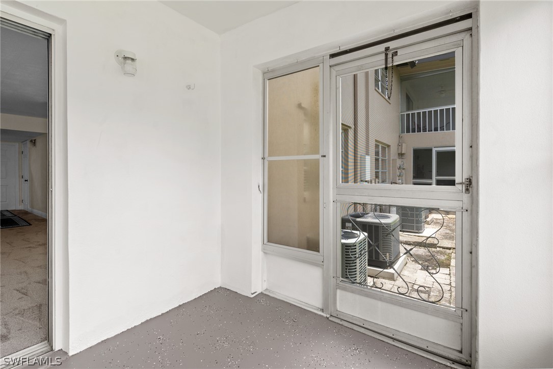 4608 Southeast 6th Avenue, Unit 1D Cape Coral, FL 33904 - Photo 44 of 49 a view of an entryway with wooden floor