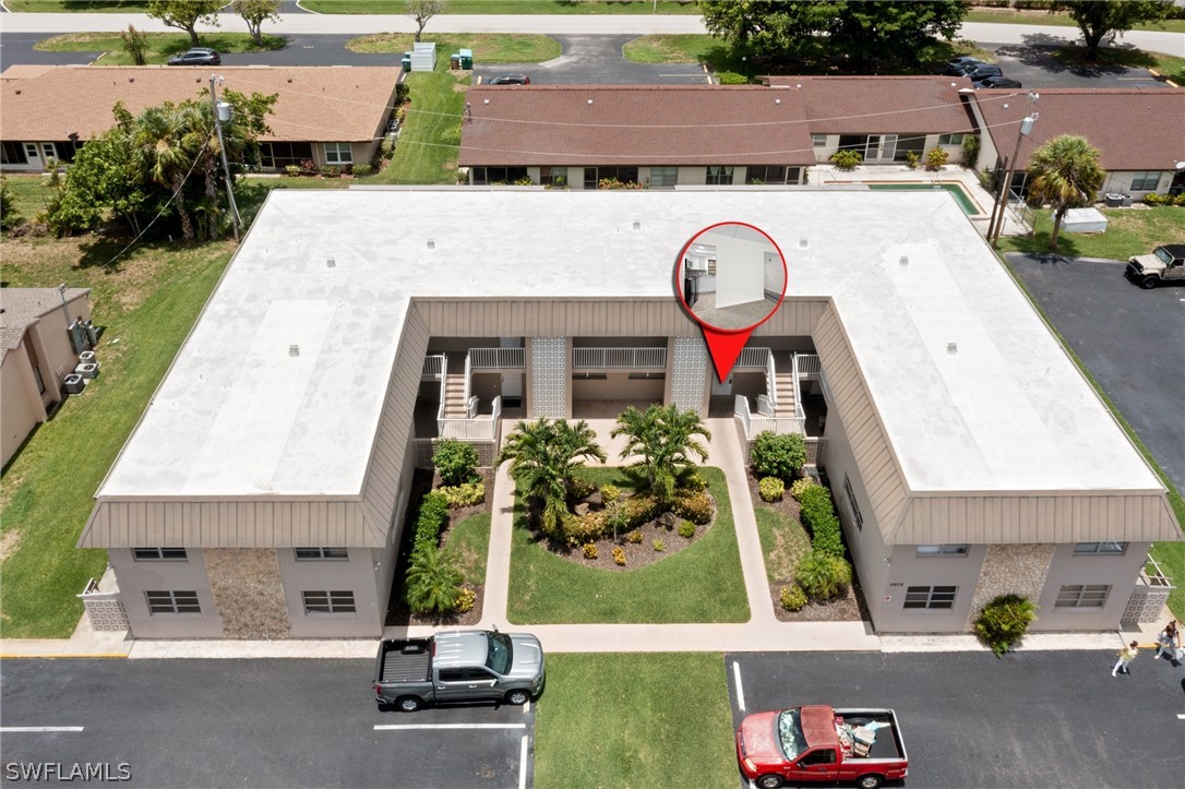 4608 Southeast 6th Avenue, Unit 1D Cape Coral, FL 33904 - Photo 48 of 49 an aerial view of a house with garden space and street view