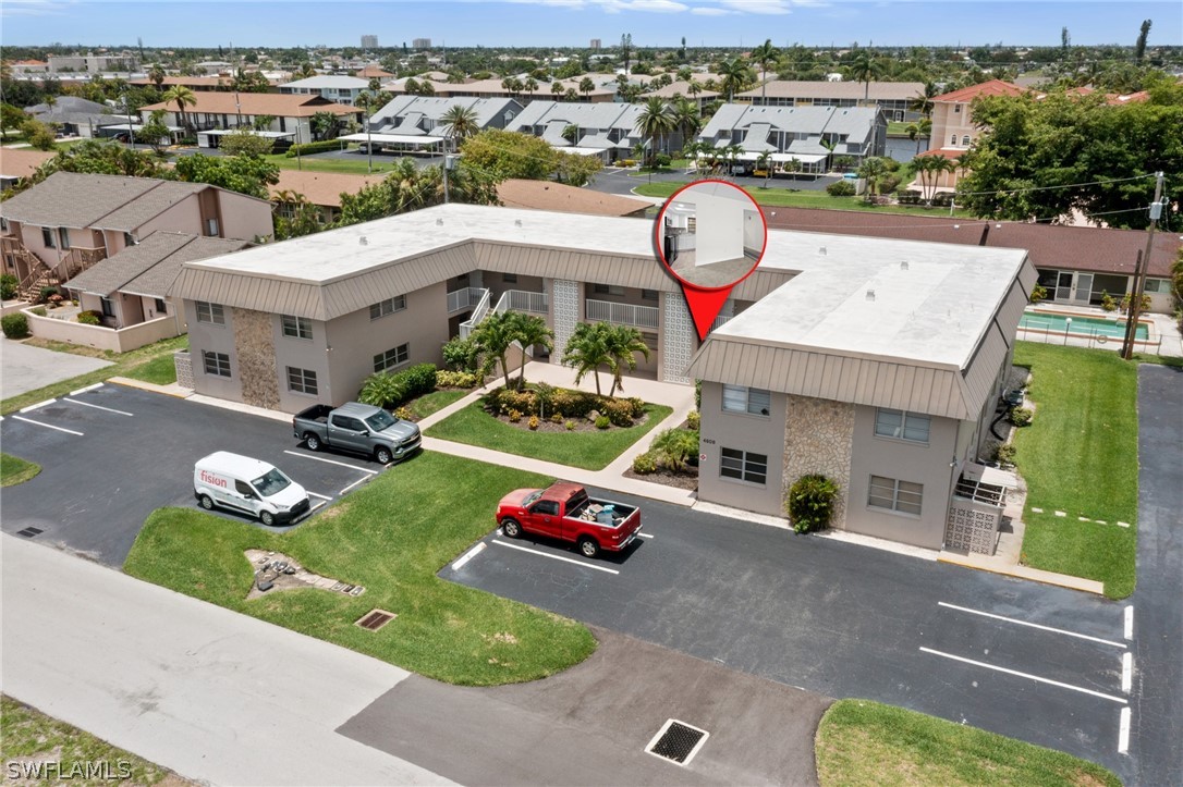 4608 Southeast 6th Avenue, Unit 1D Cape Coral, FL 33904 - Photo 49 of 49 an aerial view of residential houses with outdoor space