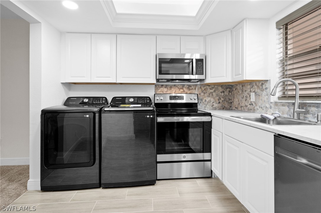 4608 Southeast 6th Avenue, Unit 1D Cape Coral, FL 33904 - Photo 6 of 49 a kitchen with a stove and a sink