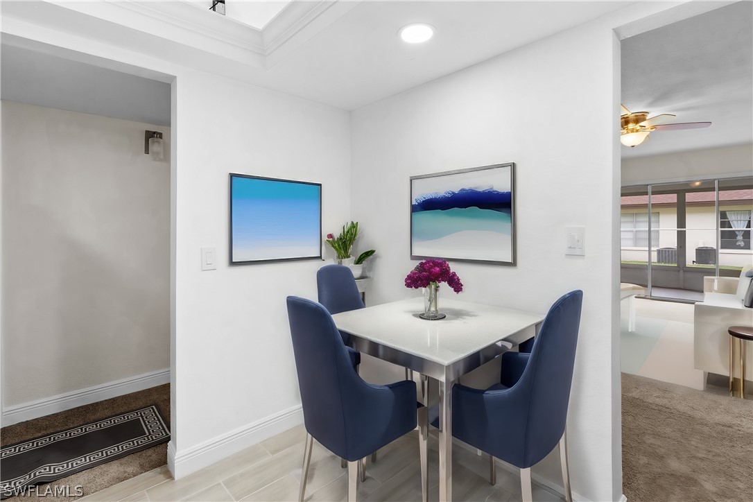 4608 Southeast 6th Avenue, Unit 1D Cape Coral, FL 33904 - Photo 10 of 49 a view of a dining room with furniture and wooden floor
