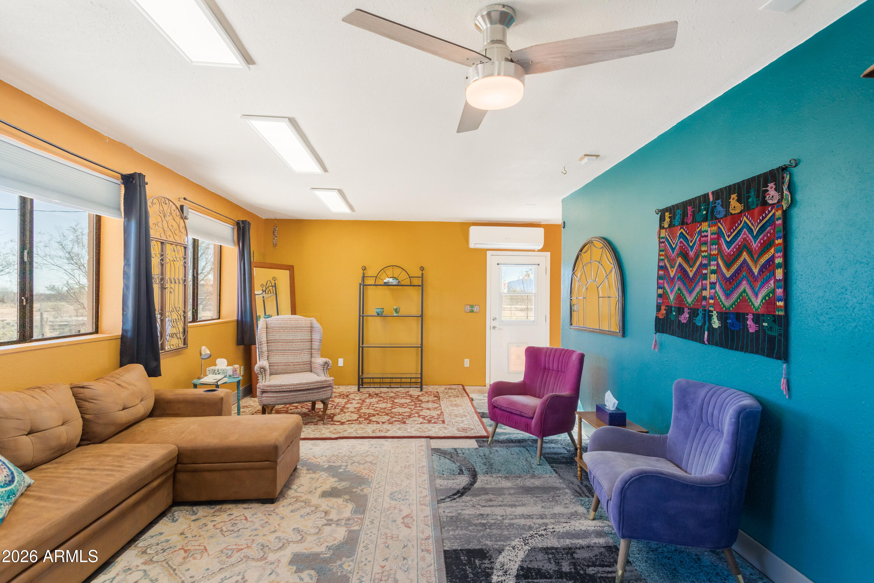 2271 North Sands Ranch Road Huachuca City, AZ 85616 - Photo 13 of 50 a living room with furniture ceiling fan and a rug