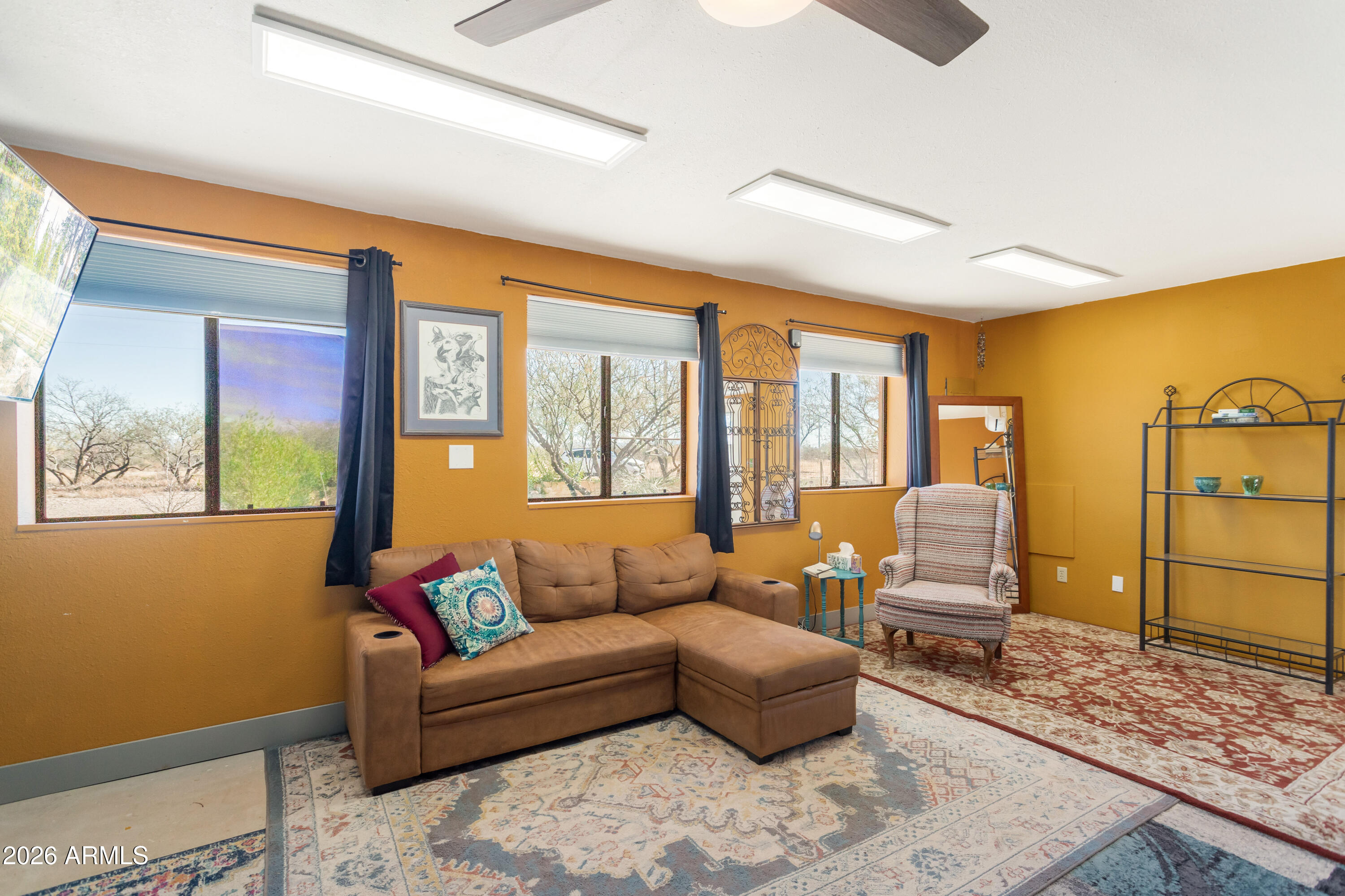 2271 North Sands Ranch Road Huachuca City, AZ 85616 - Photo 18 of 50 a living room with furniture and a rug
