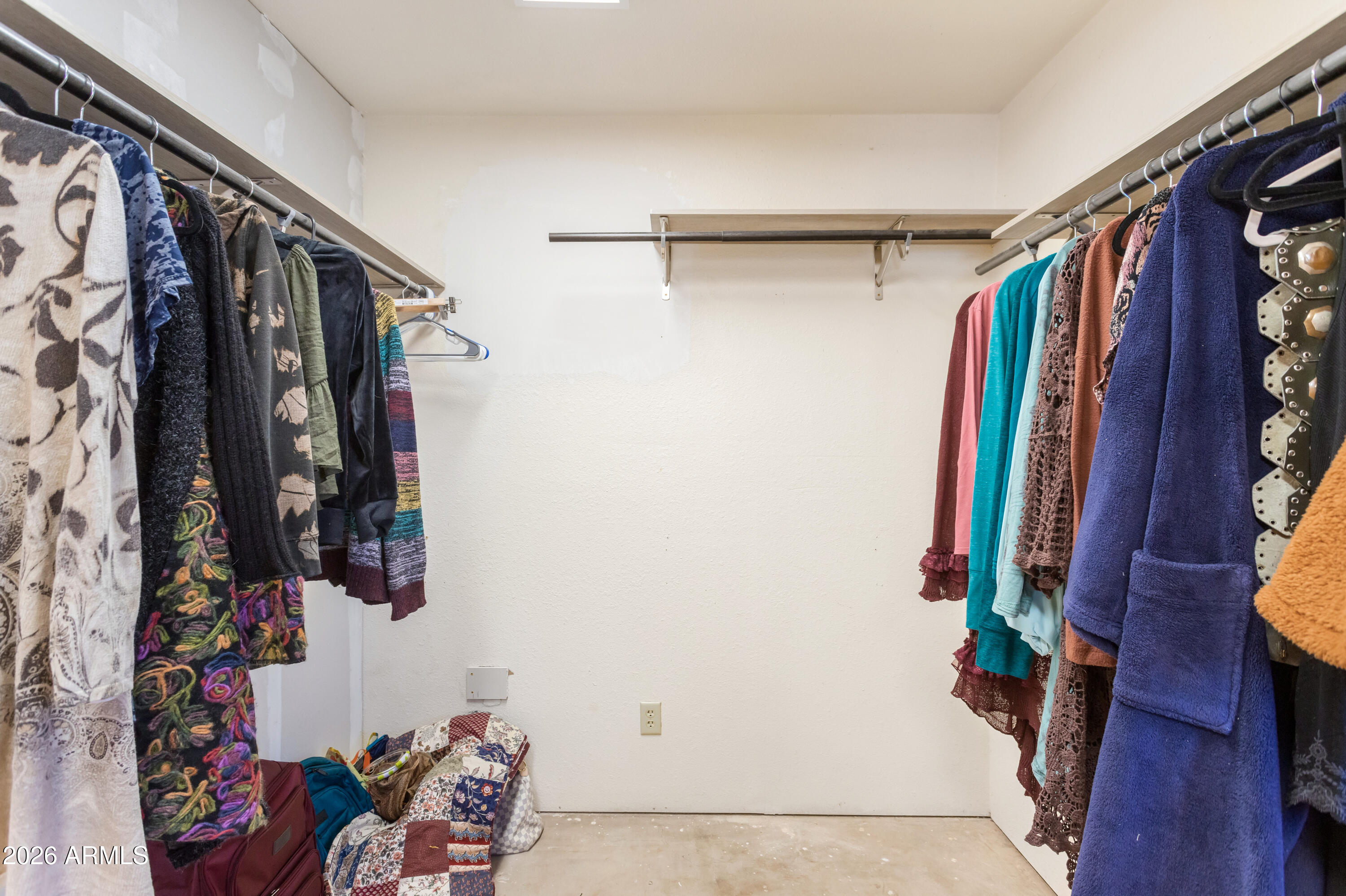 2271 North Sands Ranch Road Huachuca City, AZ 85616 - Photo 22 of 50 a view of walk in closet with clothes and shoes
