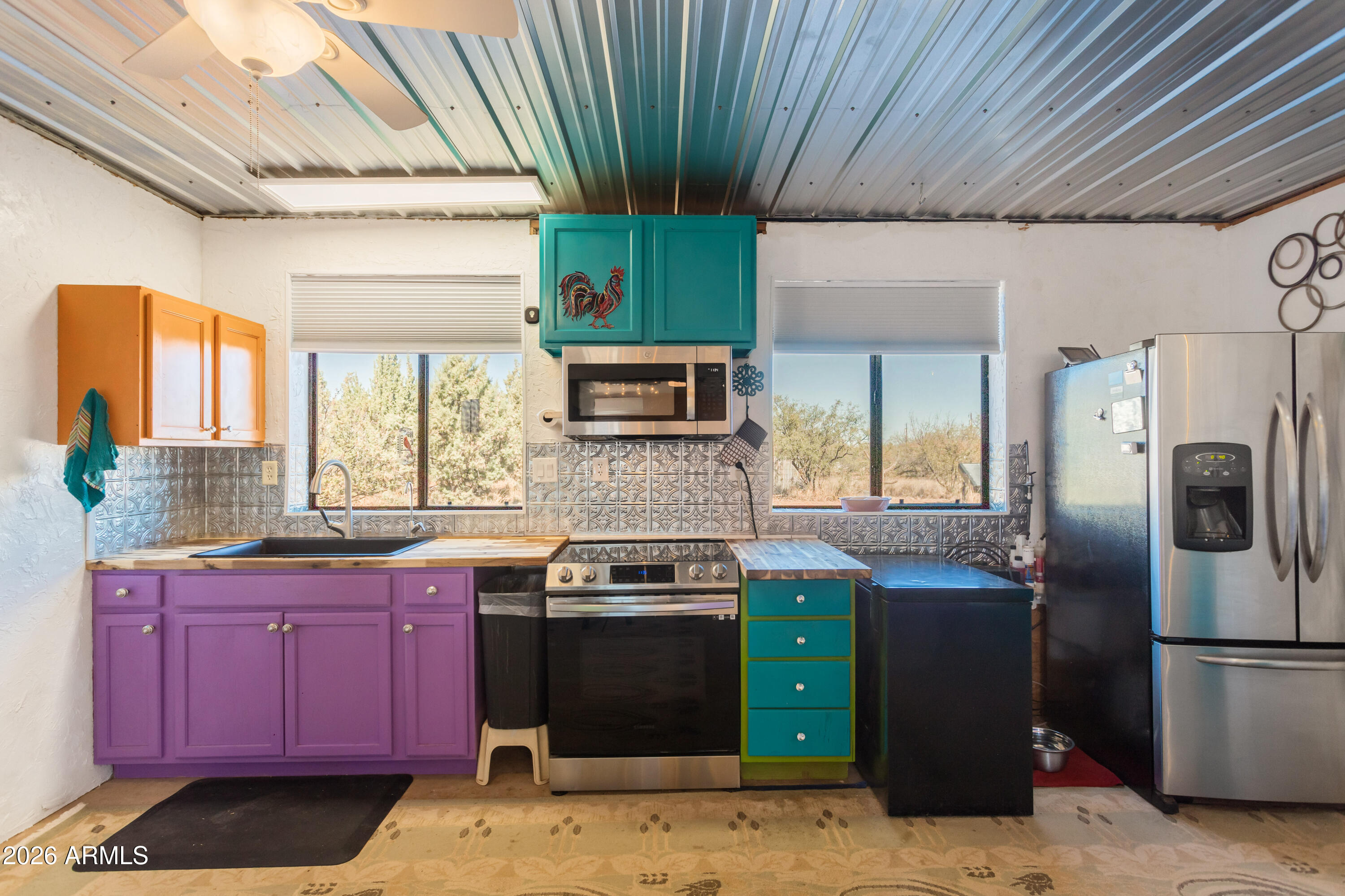 2271 North Sands Ranch Road Huachuca City, AZ 85616 - Photo 3 of 50 a kitchen with stainless steel appliances granite countertop a stove a sink dishwasher and a refrigerator