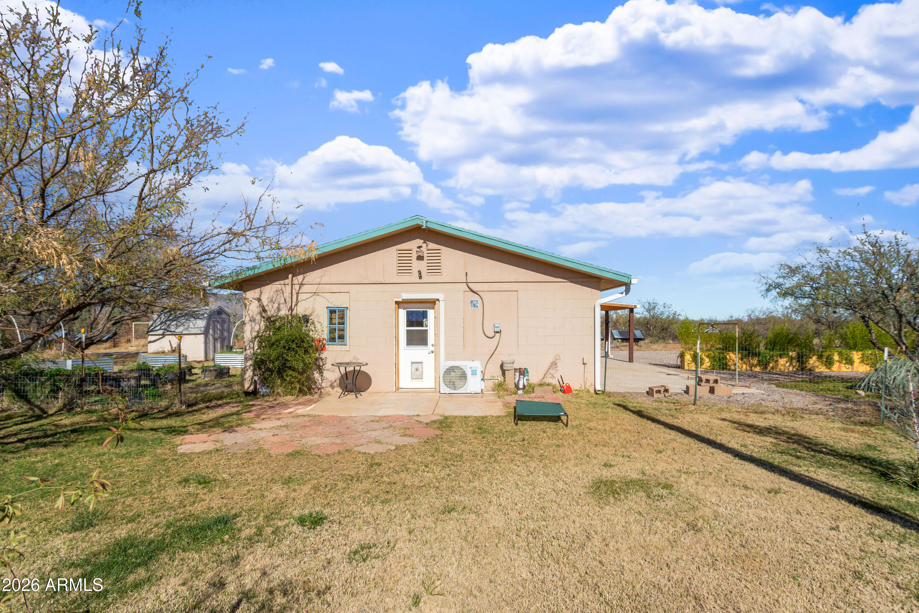 2271 North Sands Ranch Road Huachuca City, AZ 85616 - Photo 36 of 50 a view of a house with a yard