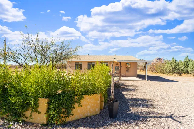 a view of a house with a snow in the yard