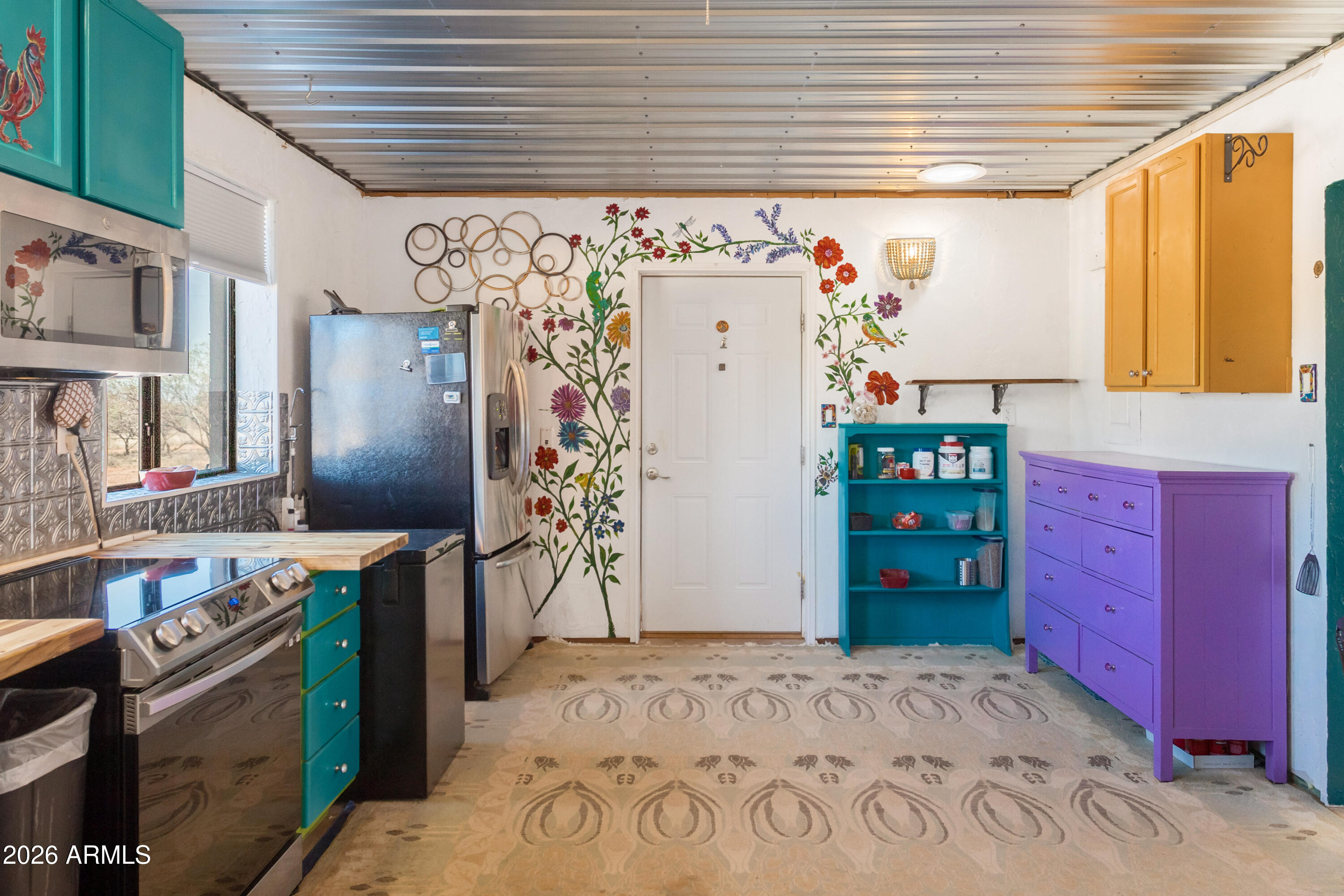 2271 North Sands Ranch Road Huachuca City, AZ 85616 - Photo 6 of 50 a view of a kitchen with fridge and window