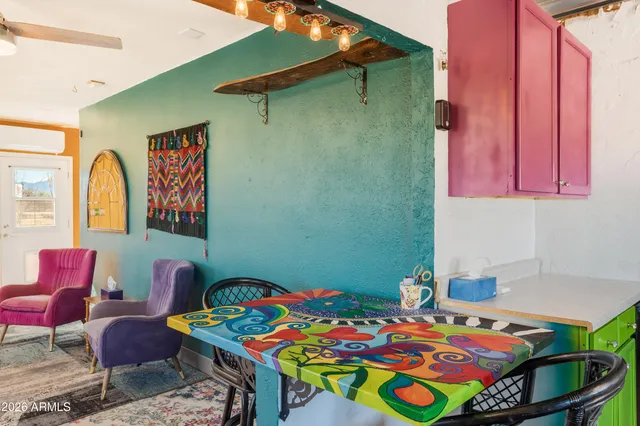 a bedroom with a bed and a table