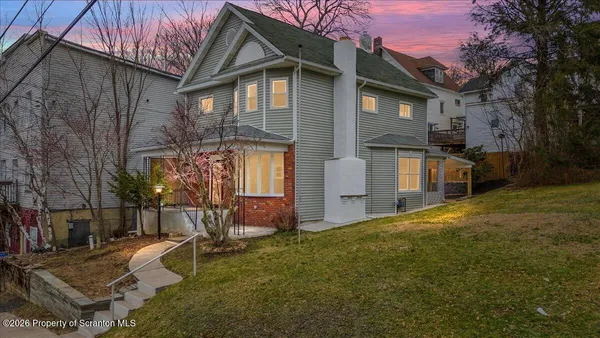 a view of a house with a yard