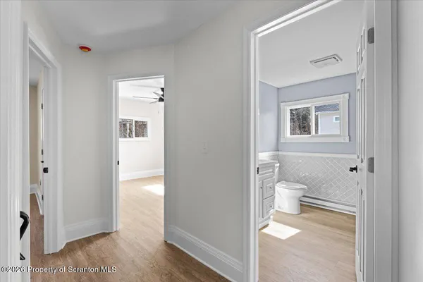 a bathroom with a toilet sink and shower