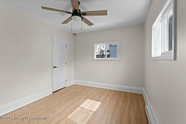 a view of room with window and ceiling fan
