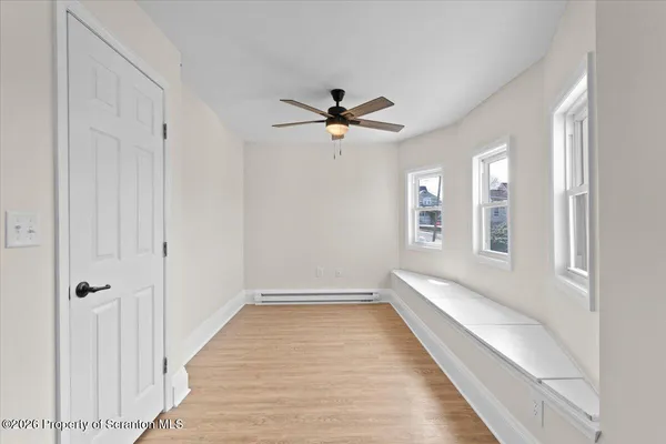 wooden floor in a hall with an entryway