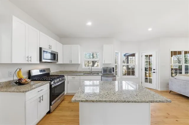 a kitchen with granite countertop lots of counter top space