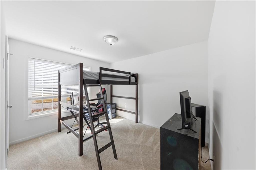 2769 Springfount Trail Northeast Lawrenceville, GA 30043 - Photo 24 of 56 a view of a room with furniture and window