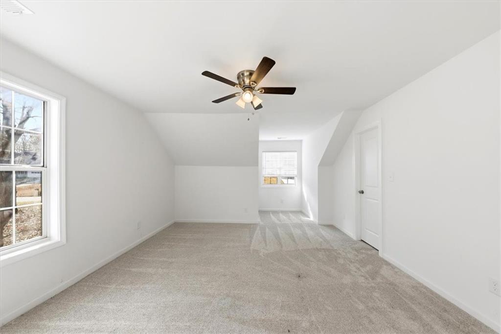 2769 Springfount Trail Northeast Lawrenceville, GA 30043 - Photo 27 of 56 an empty room with a window and a ceiling fan