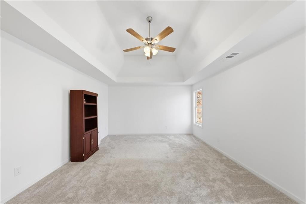 2769 Springfount Trail Northeast Lawrenceville, GA 30043 - Photo 30 of 56 an empty room with closet and windows