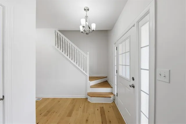a view of entryway with wooden floor