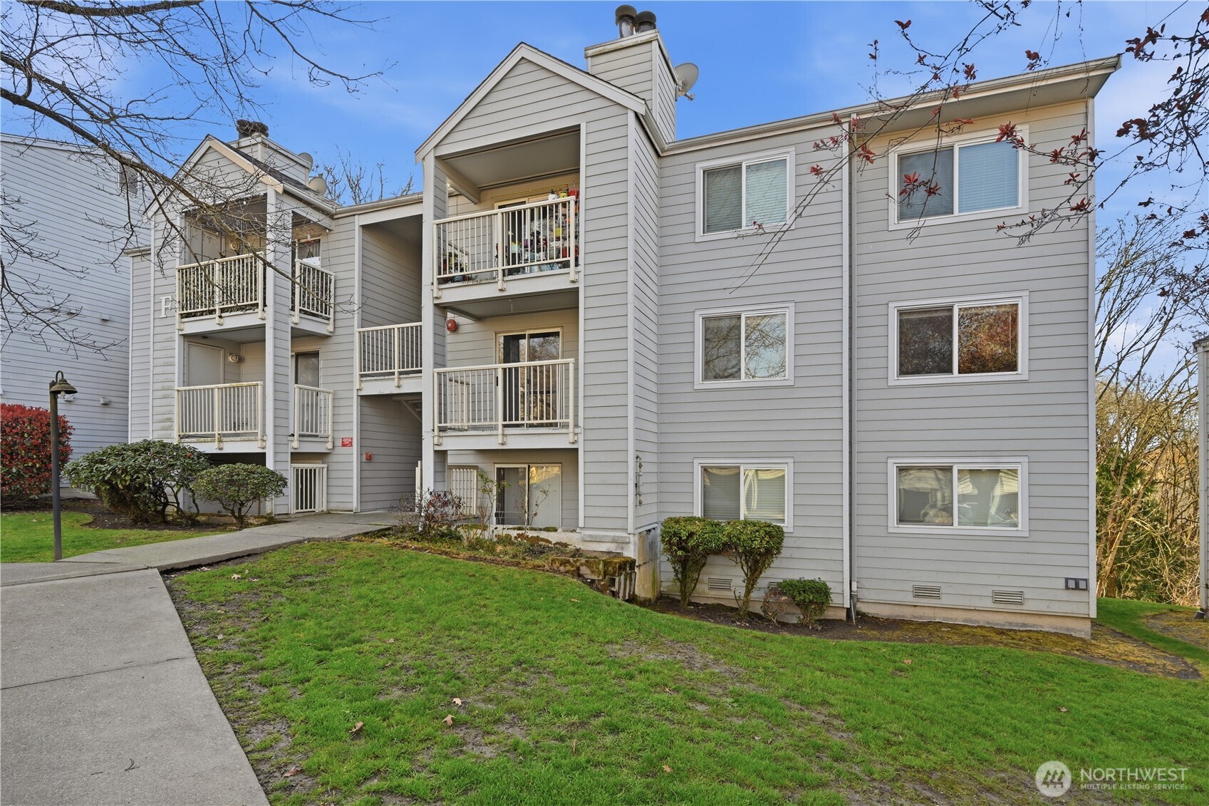 975 Aberdeen Avenue Northeast, Unit F308 Renton, WA 98056 - Photo 2 of 20 a view of a house with a yard and a large window