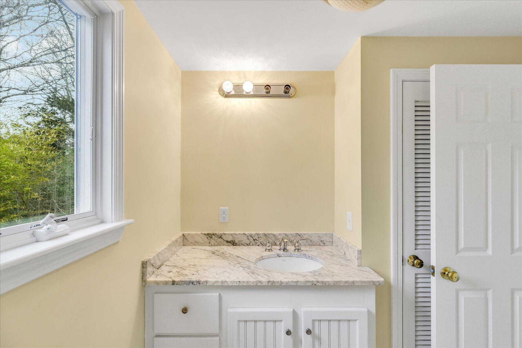 5 Dale Terrace Extension Sandwich, MA 02563 - Photo 17 of 31 a bathroom with a granite countertop sink and a mirror