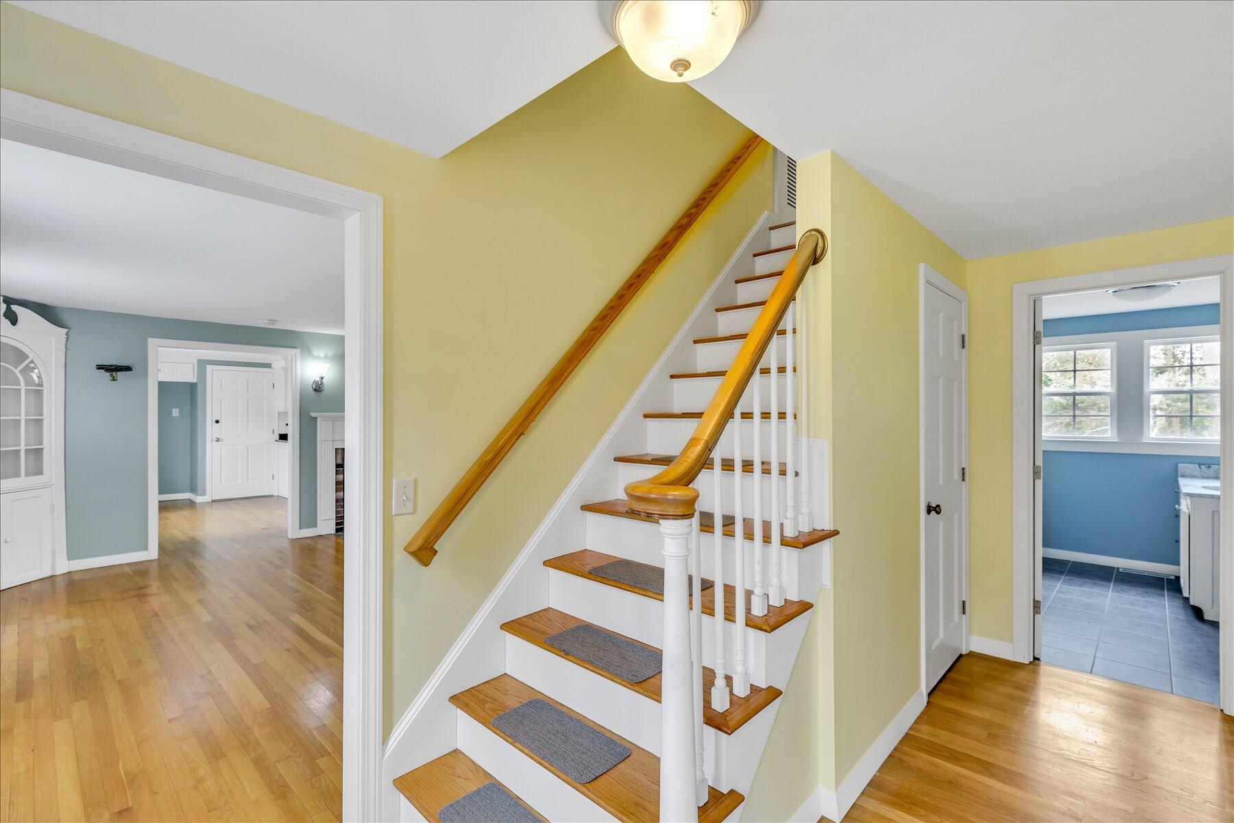 5 Dale Terrace Extension Sandwich, MA 02563 - Photo 18 of 31 a view of a hallway with wooden floor and staircase