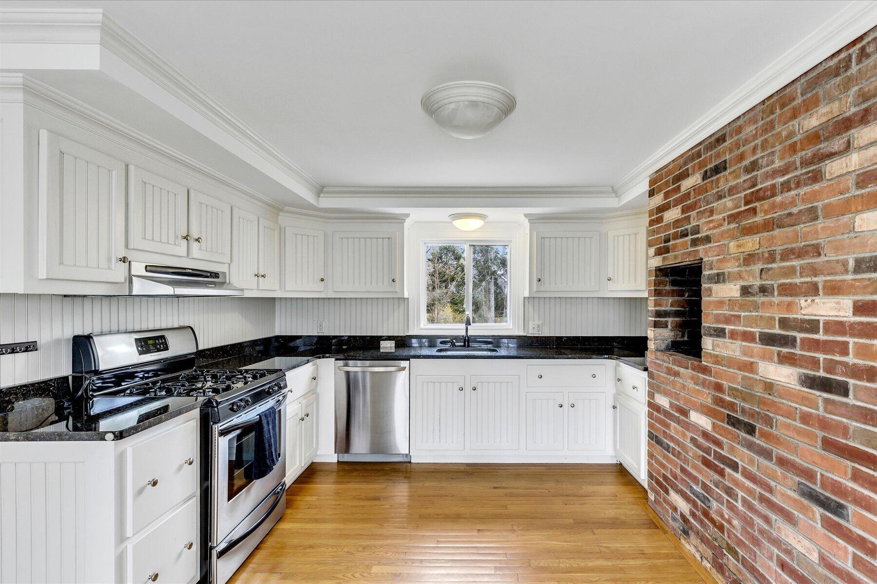 5 Dale Terrace Extension Sandwich, MA 02563 - Photo 9 of 31 a kitchen with granite countertop a stove top oven sink and cabinets