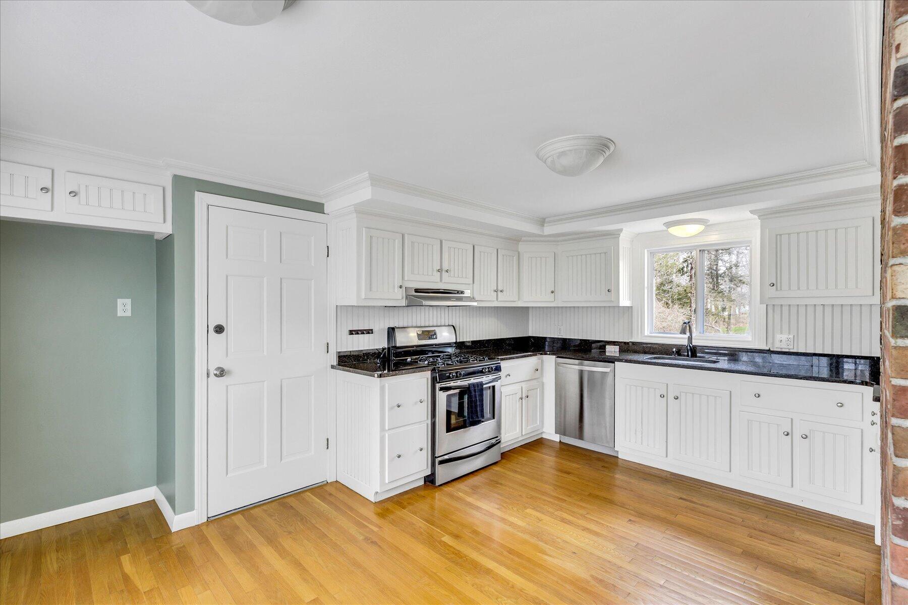 5 Dale Terrace Extension Sandwich, MA 02563 - Photo 10 of 31 a kitchen with granite countertop a stove a sink and a refrigerator