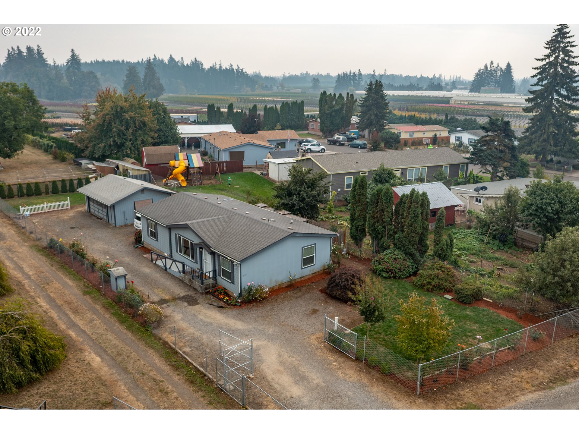17600 Northeast Boones Ferry Road Northeast Hubbard, OR 97032 - Photo 28 of 28 a aerial view of a house with a garden and a yard