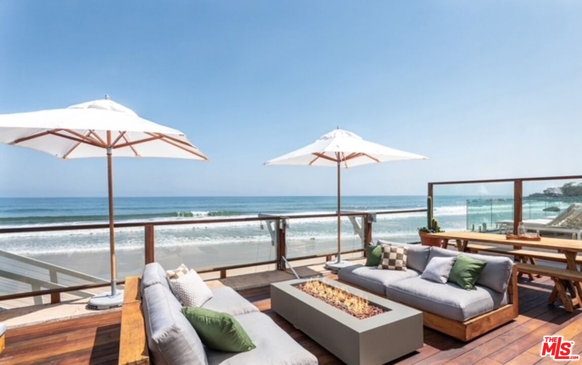 31376 Broad Beach Road Malibu, CA 90265 - Photo 1 of 32 a living room with furniture and a lamp