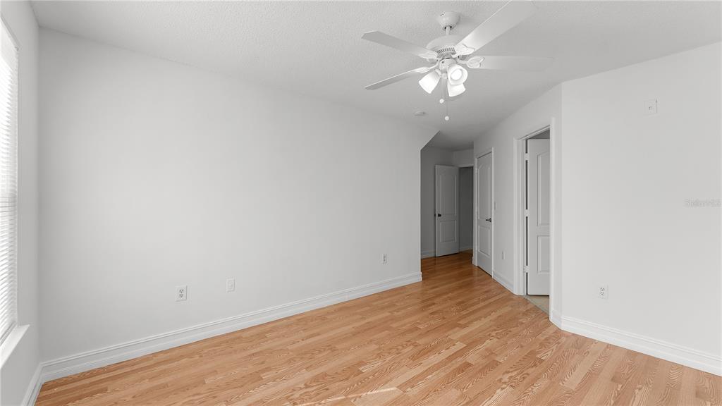12204 Wild Iris Way, Unit 103 Orlando, FL 32837 - Photo 18 of 22 wooden floor in an empty room