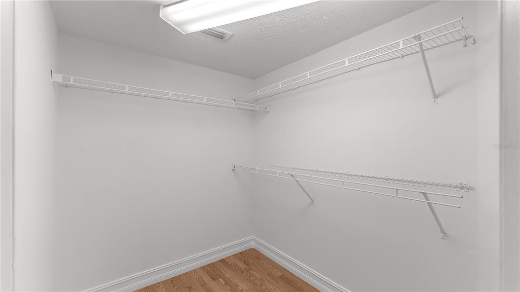 12204 Wild Iris Way, Unit 103 Orlando, FL 32837 - Photo 20 of 22 a view of a room with racks on the wall