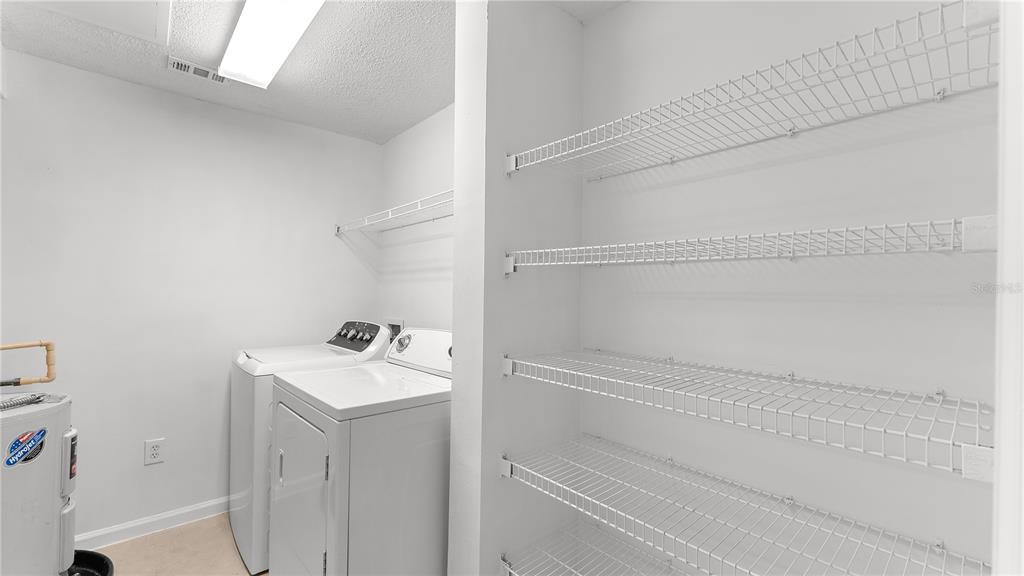 12204 Wild Iris Way, Unit 103 Orlando, FL 32837 - Photo 10 of 22 a bathroom with a sink and mirror