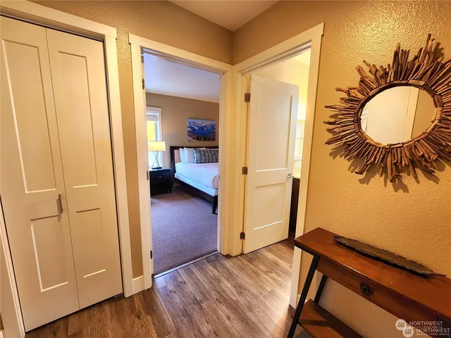 a view of a room with mirror and a bathroom