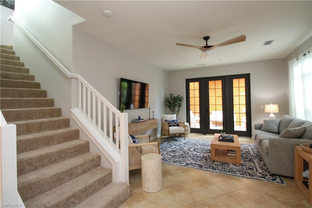 9025 Alturas Street, Unit 3102 Naples, FL 34113 - Photo 23 of 36 a living room with furniture and a large window