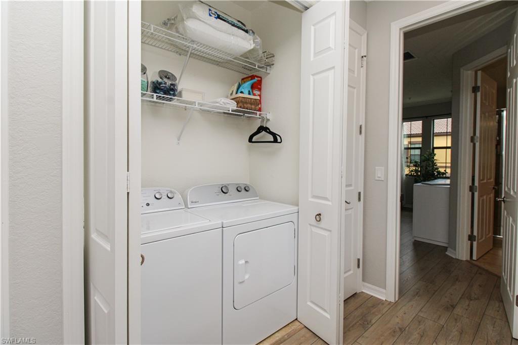 9025 Alturas Street, Unit 3102 Naples, FL 34113 - Photo 24 of 36 a view of walk in closet with clothes washer and dryer