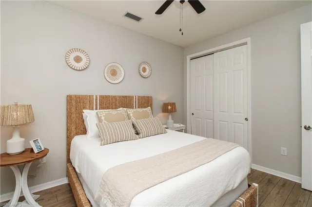 a bedroom with a bed and a table