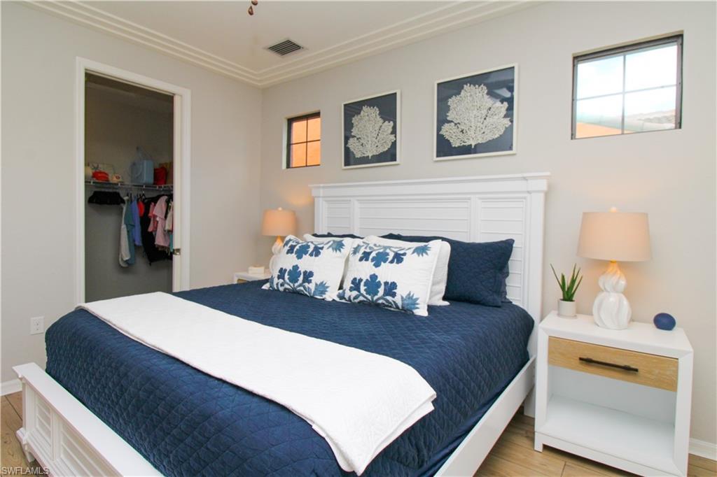 9025 Alturas Street, Unit 3102 Naples, FL 34113 - Photo 34 of 36 a bedroom with a bed and a window