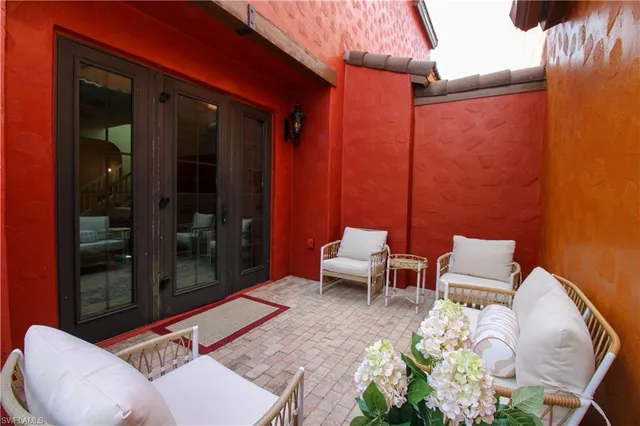 a outdoor living space with furniture and a potted plant