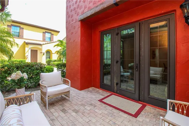 a bench is sitting in front of a house