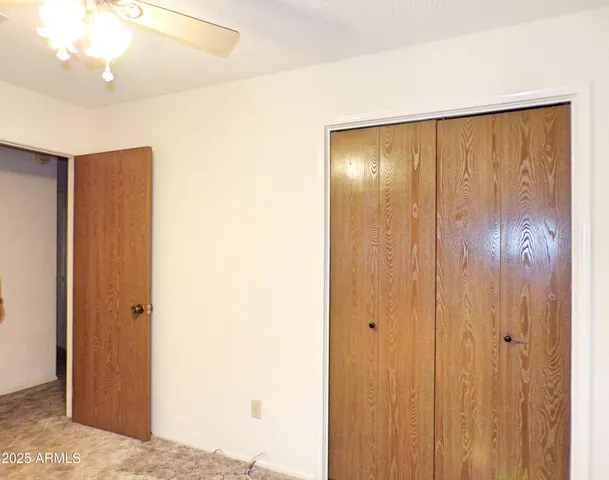 a view of a hallway with closet area