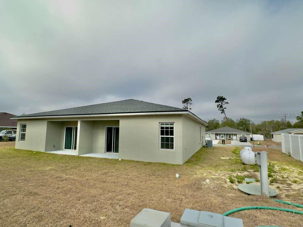 15885 Southwest 35th Court Road, Unit 1 Ocala, FL 34473 - Photo 23 of 27 a view of a house with backyard