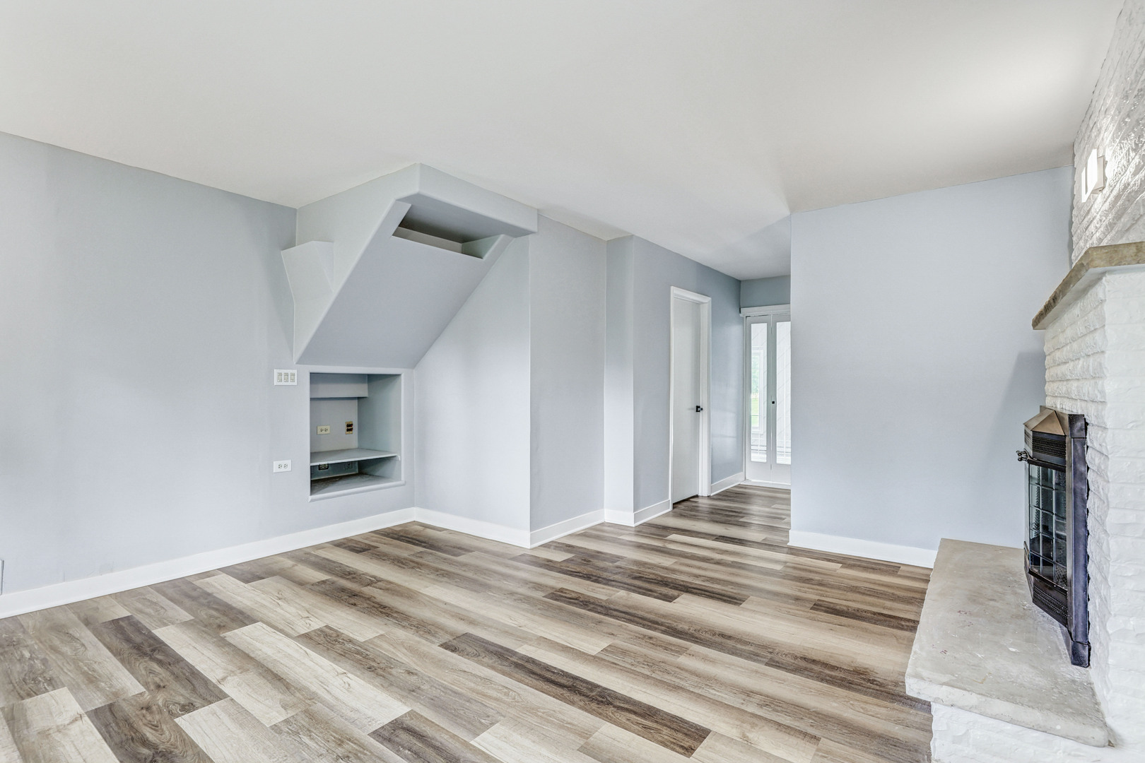 7001 Meadow Lane Road Long Grove, IL 60060 - Photo 11 of 48 a view of a bedroom with wooden floor and a bathroom