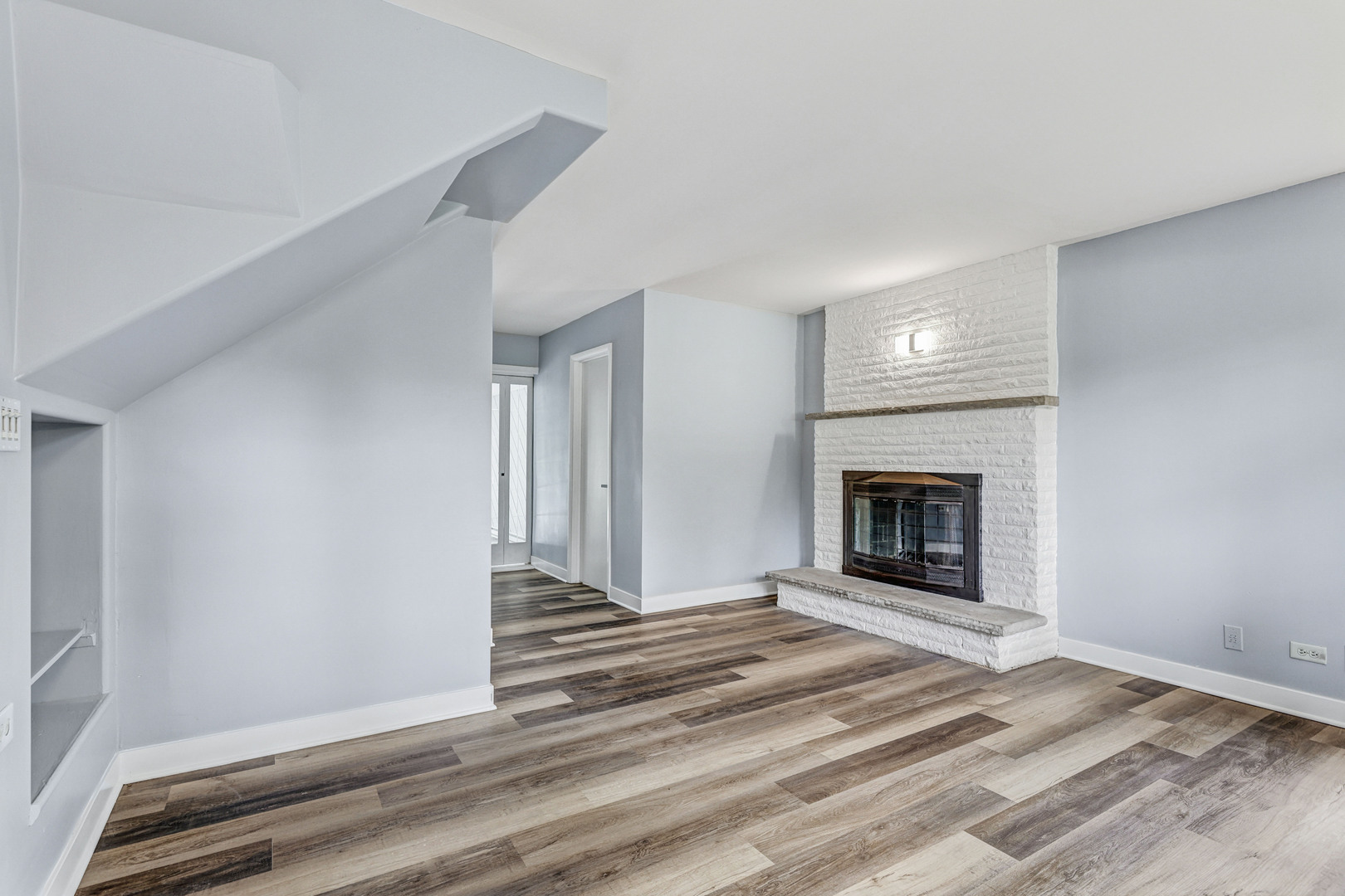 7001 Meadow Lane Road Long Grove, IL 60060 - Photo 12 of 48 a view of empty room with fireplace and wooden floor