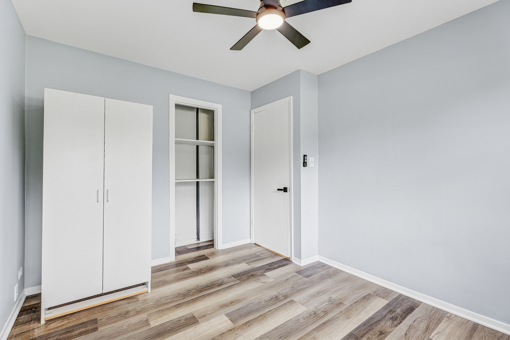 7001 Meadow Lane Road Long Grove, IL 60060 - Photo 16 of 48 a view of a room with wooden floor and closet area