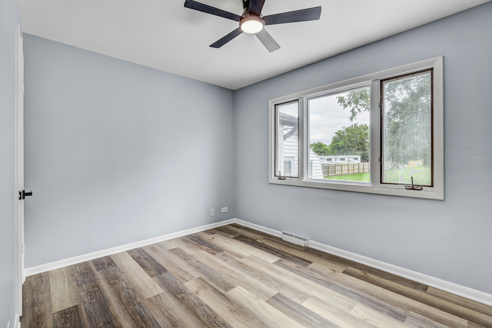7001 Meadow Lane Road Long Grove, IL 60060 - Photo 18 of 48 a view of a room with a window and a ceiling fan