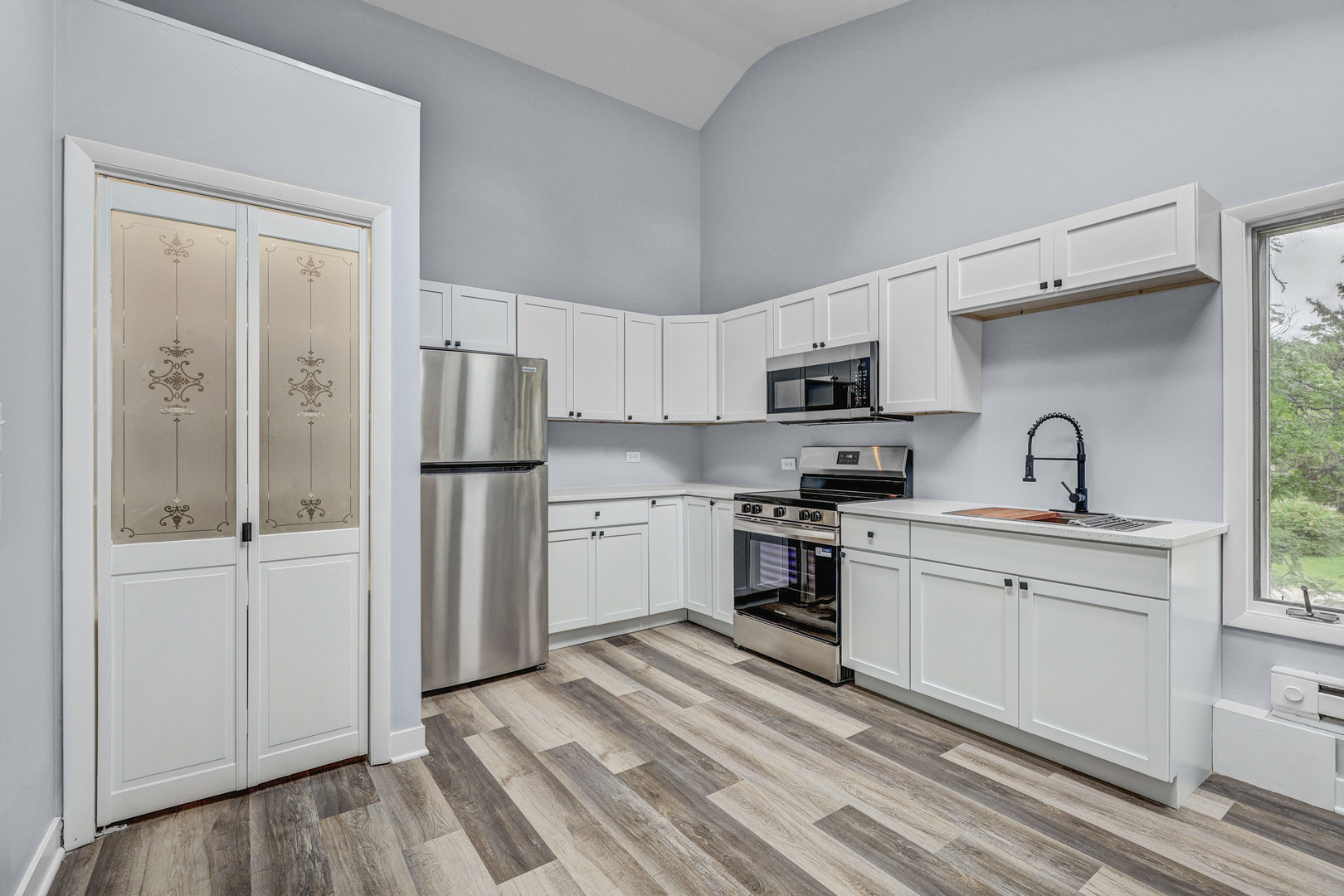 7001 Meadow Lane Road Long Grove, IL 60060 - Photo 22 of 48 a kitchen with stainless steel appliances granite countertop a refrigerator sink and stove