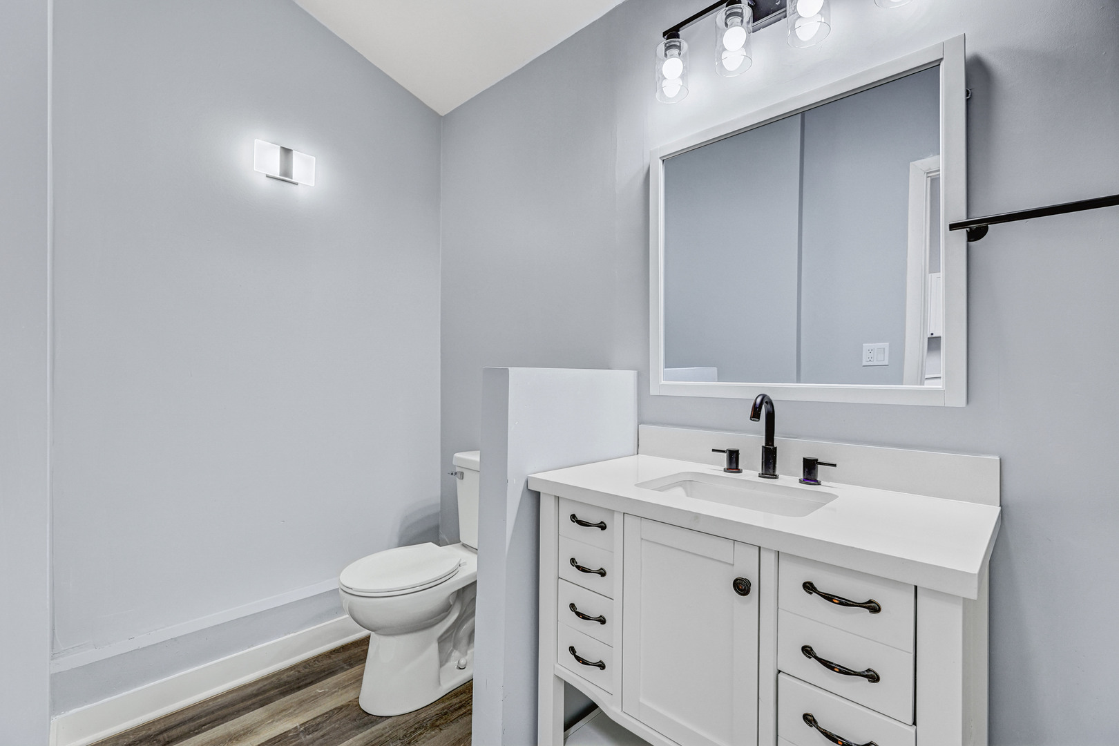 7001 Meadow Lane Road Long Grove, IL 60060 - Photo 24 of 48 a bathroom with a sink a toilet and a mirror