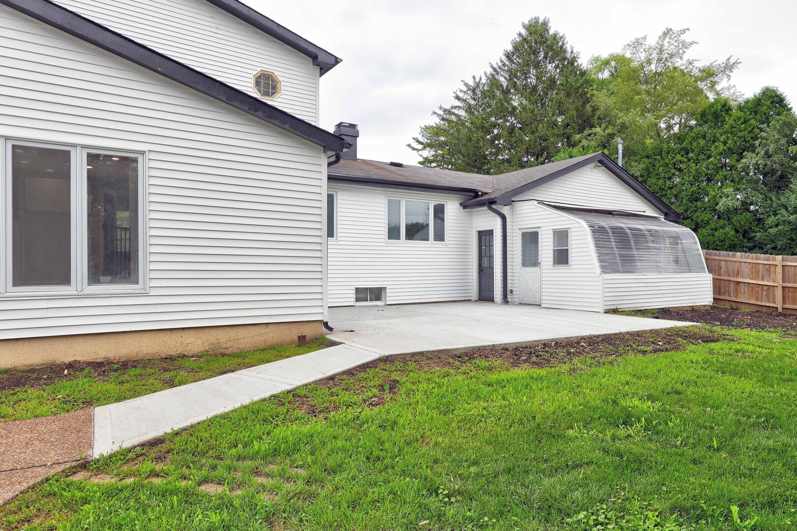 7001 Meadow Lane Road Long Grove, IL 60060 - Photo 40 of 48 a view of a white house with a yard and fence