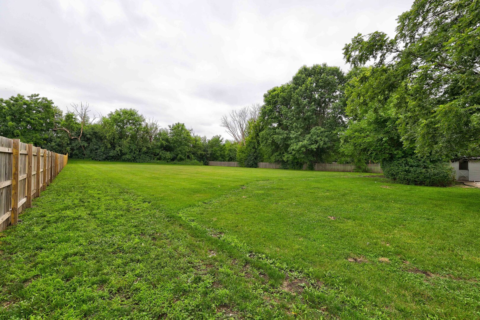 7001 Meadow Lane Road Long Grove, IL 60060 - Photo 45 of 48 a view of a green field with wooden fence