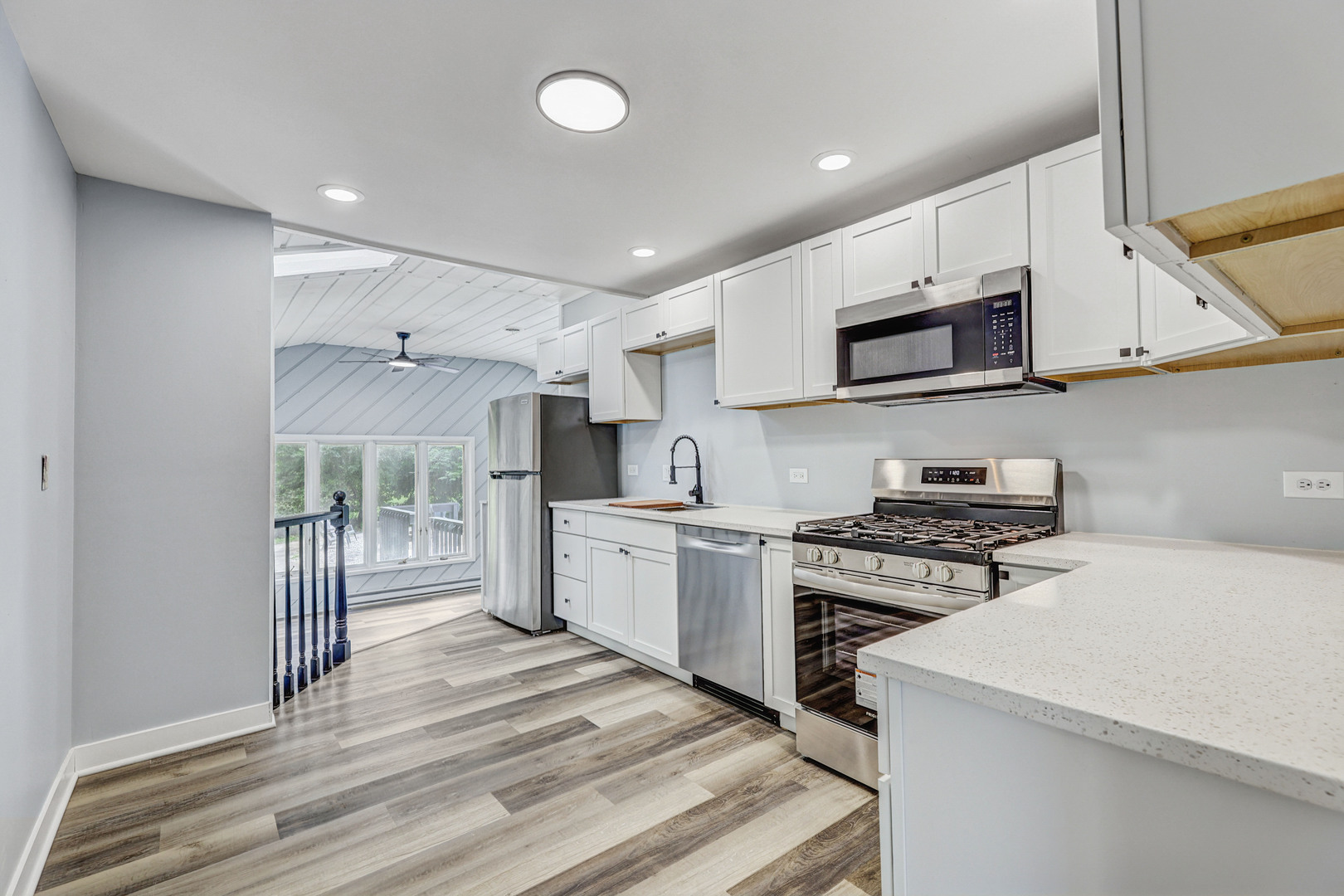7001 Meadow Lane Road Long Grove, IL 60060 - Photo 5 of 48 a kitchen with stainless steel appliances a stove microwave and cabinets